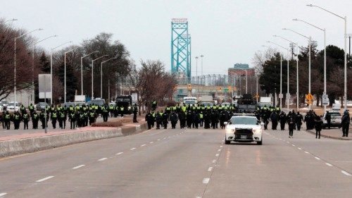 Police gather to clear protestors against Covid-19 vaccine mandates who blocked the entrance to the ...