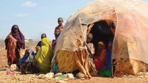 In this file photo taken on March 14, 2017 Internally displaced families gather in and outside a hut ...