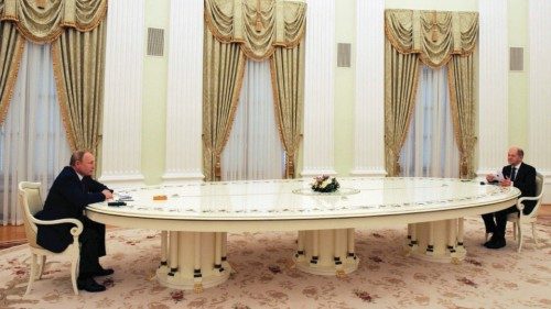 TOPSHOT - Russian President Vladimir Putin (L) and German Chancellor Olaf Scholz are seen ahead of ... TOPSHOT - Russian President Vladimir Putin (L) and German Chancellor Olaf Scholz are seen ahead of ...