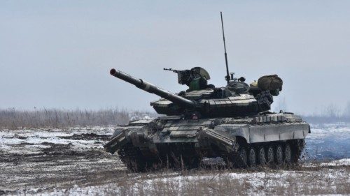 Ukrainian servicemen drive a tank during drills at a training ground in unknown location in Ukraine, ...