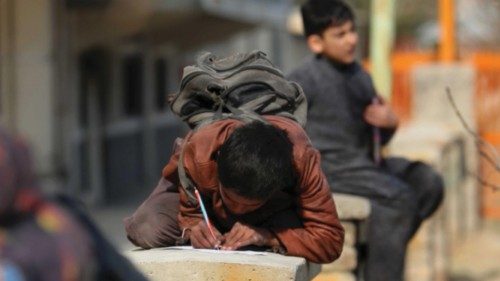 epa09776532 Afghan children take free classes provided by an Afghan woman Soda Najhand, a high ...