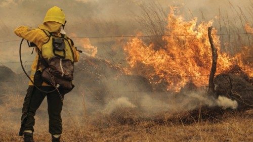 FILE PHOTO: A firefighter battles a wildfire in Corrientes, Argentina, February 15, 2022.  ...
