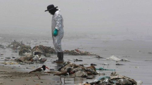 epa09760073 Cleaning staff cleans and picks up trash on Cavero beach in the district of Ventanilla ...