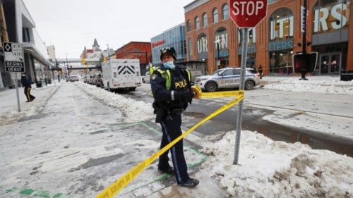 Police officers investigate after a security alert forced the Rideau Centre shopping mall to be ...