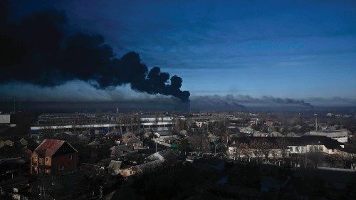 TOPSHOT - Black smoke rises from a military airport in Chuguyev near Kharkiv on February 24, 2022. ... TOPSHOT - Black smoke rises from a military airport in Chuguyev near Kharkiv on February 24, 2022. ...
