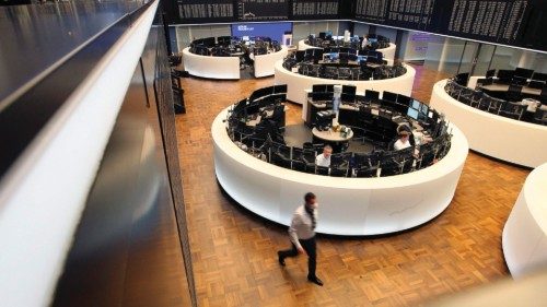 Traders works at the stock exchange in Frankfurt am Main, western Germany, on February 24, 2022. - ...
