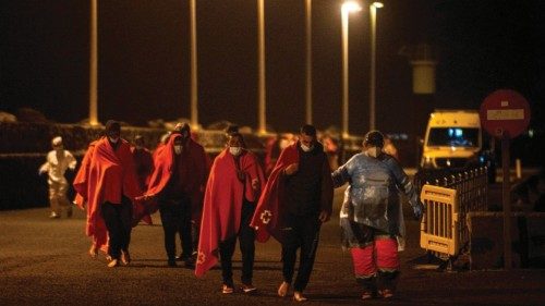 epa09775039 Red Cross members take care of migrants rescued by Spanish Maritime Safety and Rescue ...