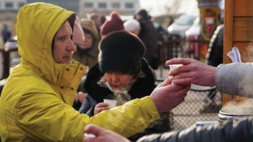 People who have recently crossed the border to flee violence in Ukraine are offered coffee in ...