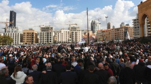 People gather near the grave of Lebanon's former prime minister Rafik al-Hariri, during the 17th ...