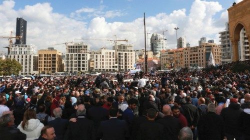 People gather near the grave of Lebanon's former prime minister Rafik al-Hariri, during the 17th ... People gather near the grave of Lebanon's former prime minister Rafik al-Hariri, during the 17th ...
