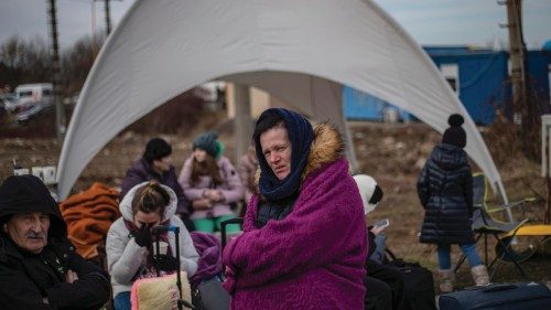 epa09786166 People fleeing Ukraine arrive to Slovakia, at border crossing in Vysne Nemecke, ...