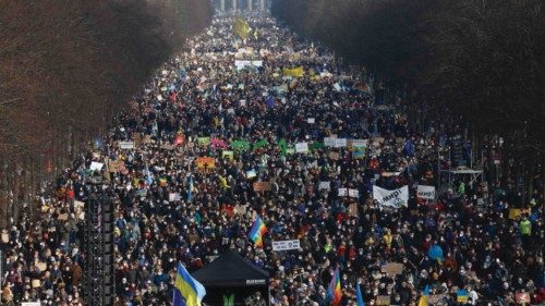 Protesters crowd around the victory column and close to the Brandenburg Gate in Berlin to ...