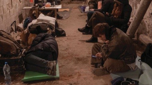 Residents take shelter in the basement of an apartment building, after Russia launched a massive ... Residents take shelter in the basement of an apartment building, after Russia launched a massive ...