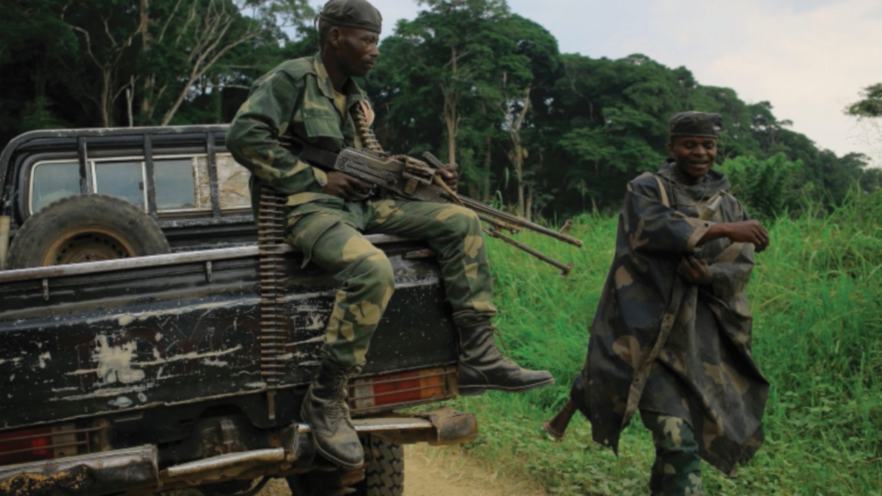 In this file photo taken on December 08, 2021 soldiers with the DRCongo armed forces travel on the ...