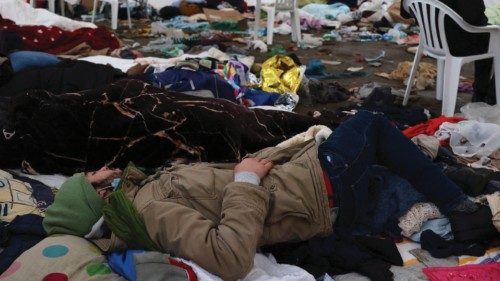 Refugees rest in a tent, after fleeing from Ukraine following the Russian invasion, at the border ...