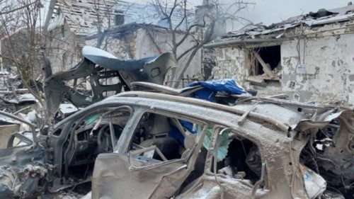A view shows destroyed buildings and vehicles in a residential area, as Russia's invasion of Ukraine ...