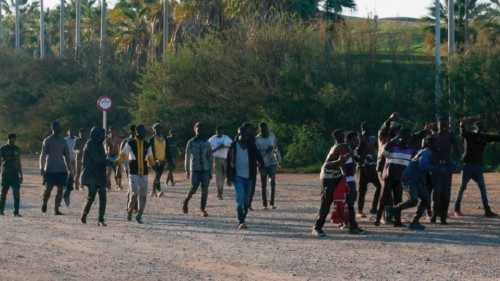 epa09798403 Dozen of migrants celebrate after they managed to jump Spanish-Moroccan border in the ... epa09798403 Dozen of migrants celebrate after they managed to jump Spanish-Moroccan border in the ...