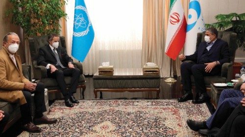 epa09802913 Head of Atomic Energy Organization of Iran Mohammad Eslami (R) talks to with Rafael ...