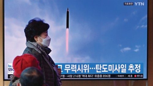 People watch a television screen showing a news broadcast with file footage of a North Korean ... People watch a television screen showing a news broadcast with file footage of a North Korean ...