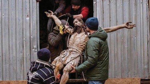 Jesus Christ statue being taken out of Armenian Cathedral of Lviv, Ukraine, to be stored in a bunker ...