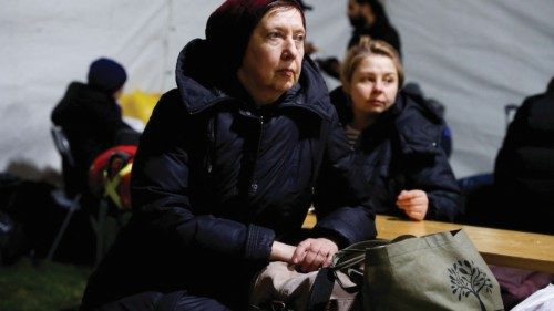 A woman fleeing Russia's invasion of Ukraine sits at a temporary shelter outside the train station ... A woman fleeing Russia's invasion of Ukraine sits at a temporary shelter outside the train station ...