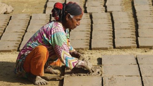 epa09807162 Hilal Bibi, age 90, makes clay pots at a workshop ahead of International Women's Day on ...