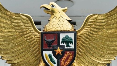 An Indonesian man cleans the country's symbol Garuda Pancasila, a mythical golden eagle with a ... An Indonesian man cleans the country's symbol Garuda Pancasila, a mythical golden eagle with a ...