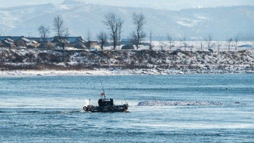 In this photo taken on January 10, 2018, a North Korean naval boat patrols on the Yalu river in ...
