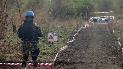 A UN peace keeper from the United Nations Mine Action Service (UNMAS) secures the site of a planned ...