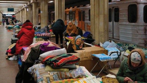 Kharkiv residents rest as they shelter from attacks in a metro station of Kharkiv on March 10, 2022. ...