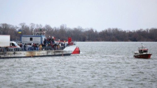 People arrive by ferry after fleeing from Russia's invasion of Ukraine, at the Isaccea-Orlivka ...