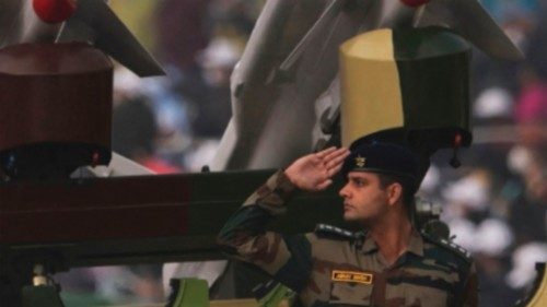 (FILES) In this file photo taken on January 26, 2022 a soldier salutes next to an Akash missile ...