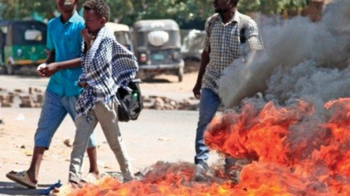 Sudanese anti-coup protesters burn tyres during a demonstration calling for civilian rule and ...
