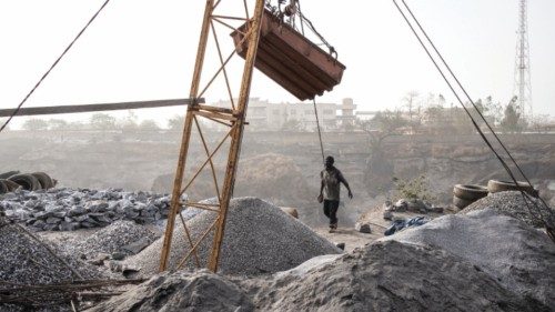 A man sorts the different sizes granite at Pissy Granite Mine in the centre of Ouagadougou on ...