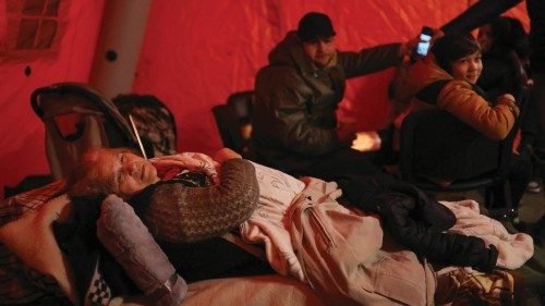 Margarita Nokolai, 77 and an Ukrainian refugee, rests inside a temporal shelter after disembarking a ...