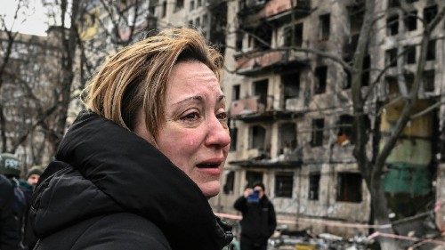 EDITORS NOTE: Graphic content / TOPSHOT - A woman reacts as she stands outside destroyed apartment ... EDITORS NOTE: Graphic content / TOPSHOT - A woman reacts as she stands outside destroyed apartment ...