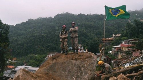 Firefighters are seen during a rescue mission after a giant landslide at Caxambu neighborhood in ...