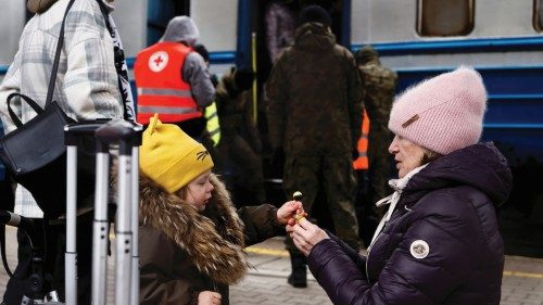 People arrive in a Ukrainian train from Lviv that is transporting hundreds of people fleeing from ...