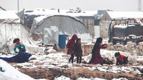 Children play in the snow at a camp for internally displaced Syrians, near the town of Kafr Lusin, ... Children play in the snow at a camp for internally displaced Syrians, near the town of Kafr Lusin, ...