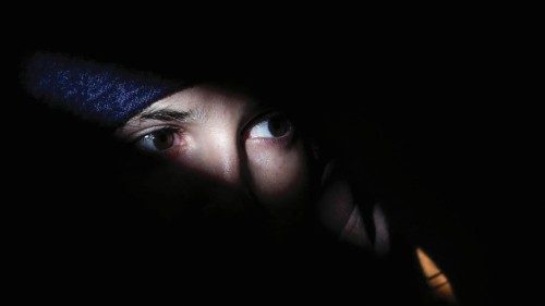 epa09831579 A Ukrainian refugee boy looks from inside a volunteer tent as he waits to cross the ... epa09831579 A Ukrainian refugee boy looks from inside a volunteer tent as he waits to cross the ...