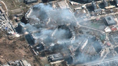 A satellite image shows burning apartment buildings in Mariupol, Ukraine, March 19, 2022. Satellite ...