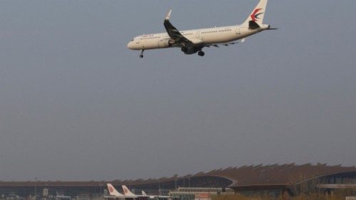 A plane of China Eastern Airlines lands at the Beijing Capital International Airport in Beijing, ...