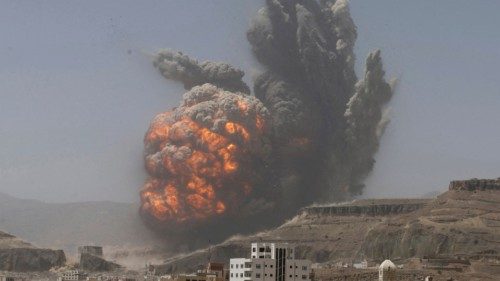 FILE PHOTO: Smoke rises during an air strike on an army weapons depot on a mountain overlooking ...