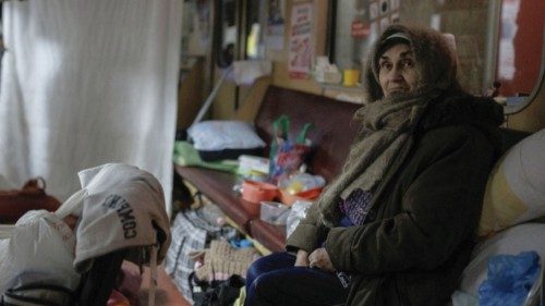 Raisa sits in a stationary subway car in a metro station in northern Kharkiv where she lives to ...