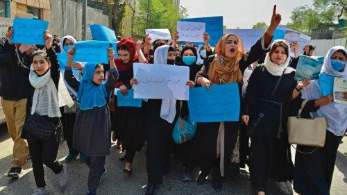 TOPSHOT - Afghan women and girls take part in a protest in front of the Ministry of Education in ...