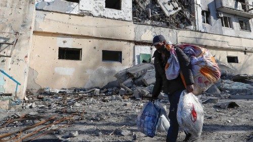Local resident and shoemaker Gennady, who didn't give his full name, transports belongings from his ... Local resident and shoemaker Gennady, who didn't give his full name, transports belongings from his ...