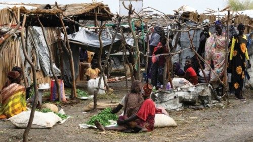 People sit by damaged huts at the inundated Dibba Busin camp for South Sudanese refugees in Sudan's ... People sit by damaged huts at the inundated Dibba Busin camp for South Sudanese refugees in Sudan's ...