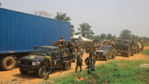 Vehicles of FARDC (Armed Forces of the Democratic Republic of Congo) soldiers escort civilian ...