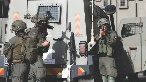 Israeli soldiers take part in a raid in Ramallah, in the Israeli-occupied West Bank April 1, 2022. ...