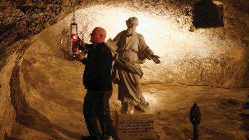 Priest Joseph Mizzi replaces a candle in St Paul's Grotto beneath St Paul's Basilica during final ...